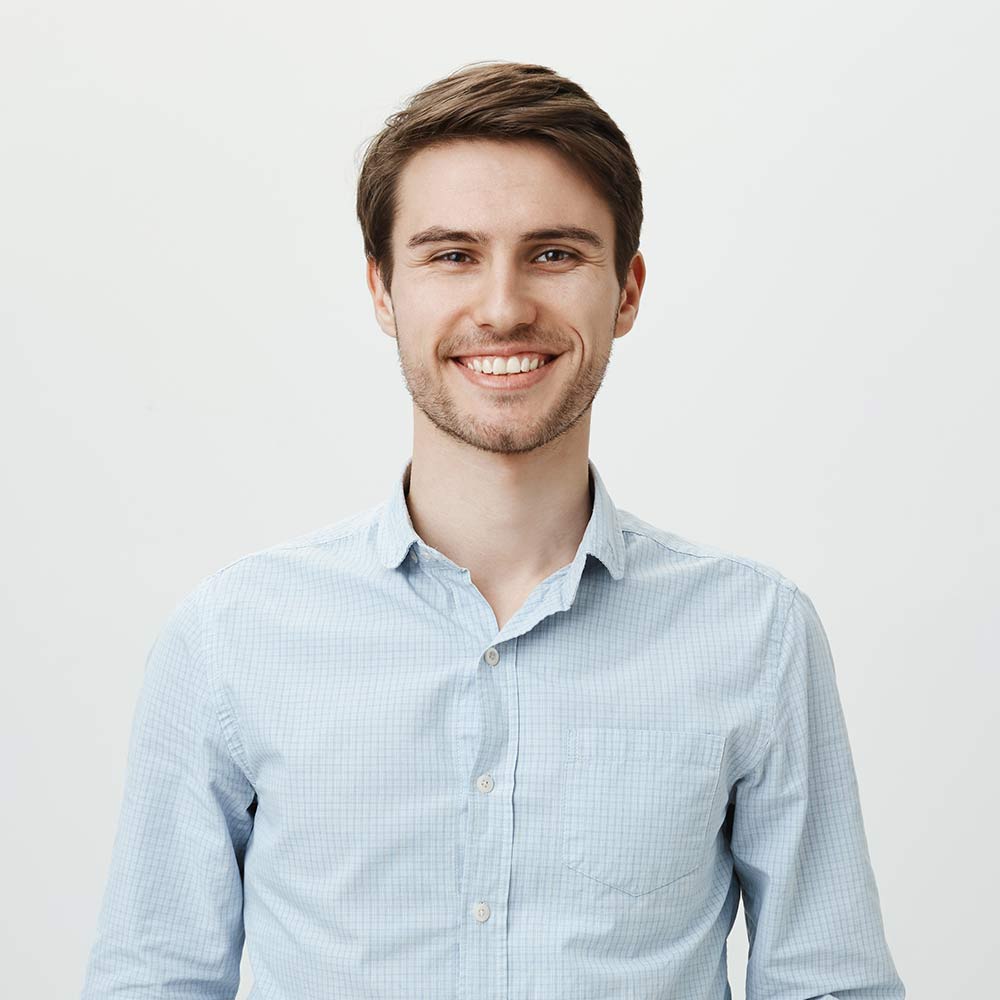 smiling-brunette-man-poses-in-a-light-shirt-2026-01-05-05-13-24-utc.jpg
