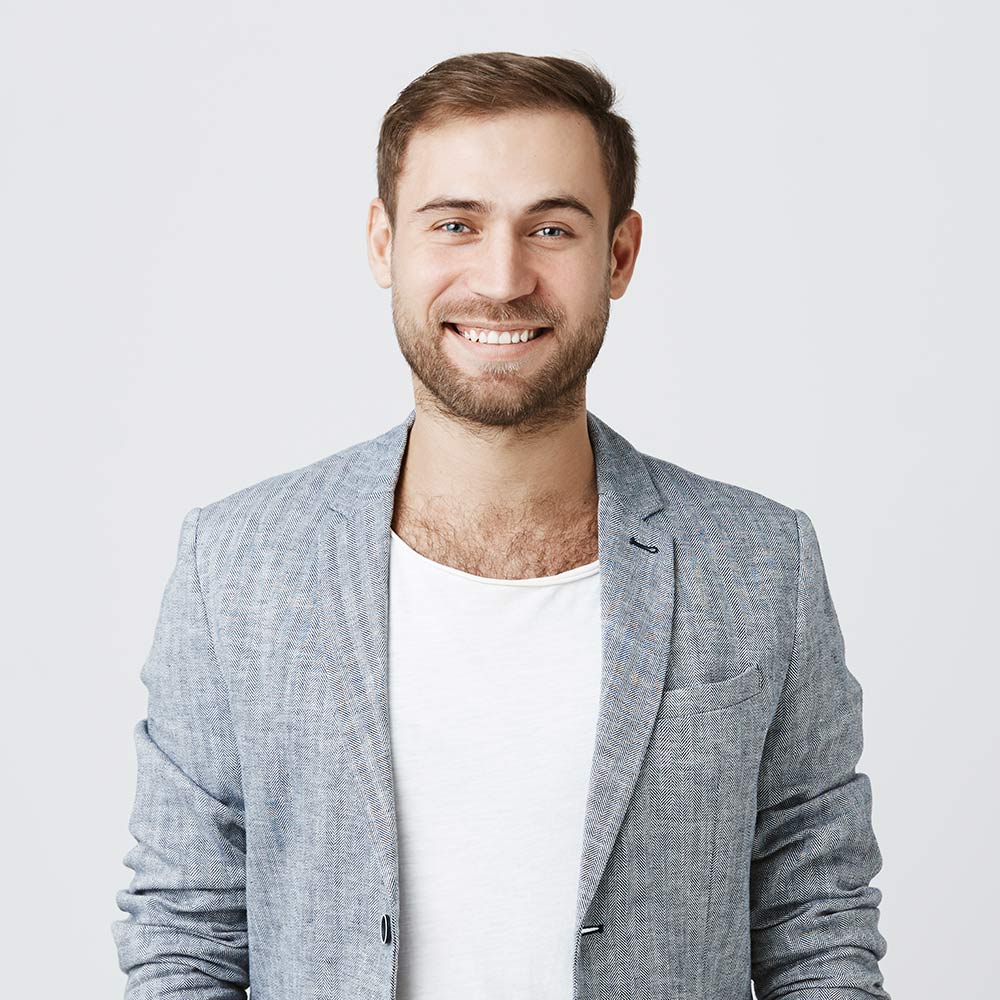 smiling-man-in-jacket-posing-indoors-2026-01-05-05-14-15-utc.jpg